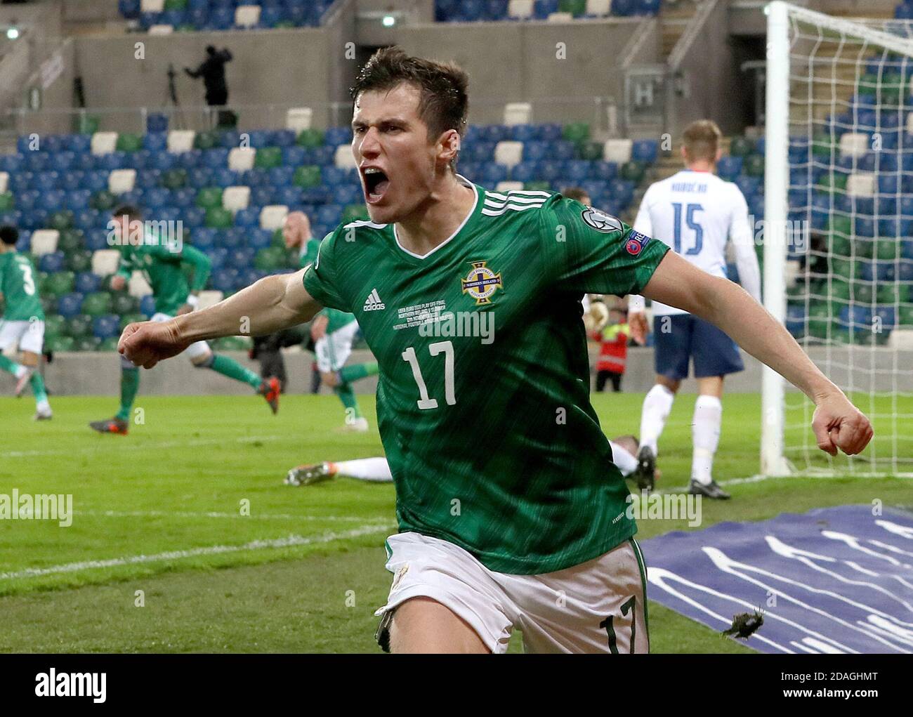 Norther Ireland's Paddy McNair celebrates after Slovakia's Milan Skriniar (not pictured) scores an own goal during the UEFA Euro 2020 Play-off Finals match at Windsor Park, Belfast. Stock Photo