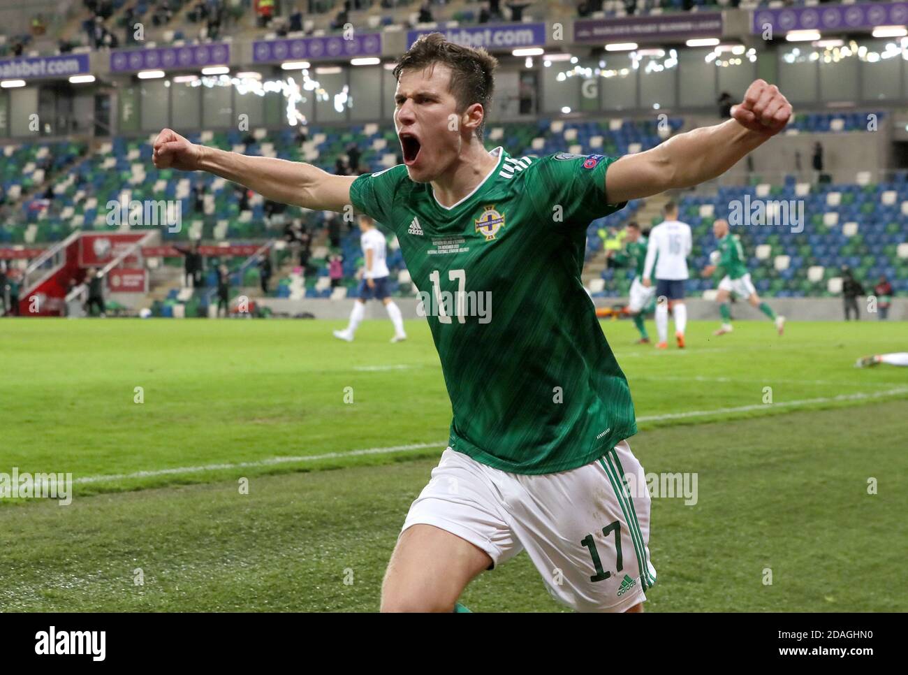 Norther Ireland's Paddy McNair celebrates after Slovakia's Milan Skriniar (not pictured) scores an own goal during the UEFA Euro 2020 Play-off Finals match at Windsor Park, Belfast. Stock Photo