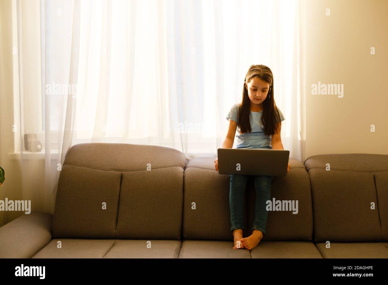 little girl studying with computer Stock Photo - Alamy