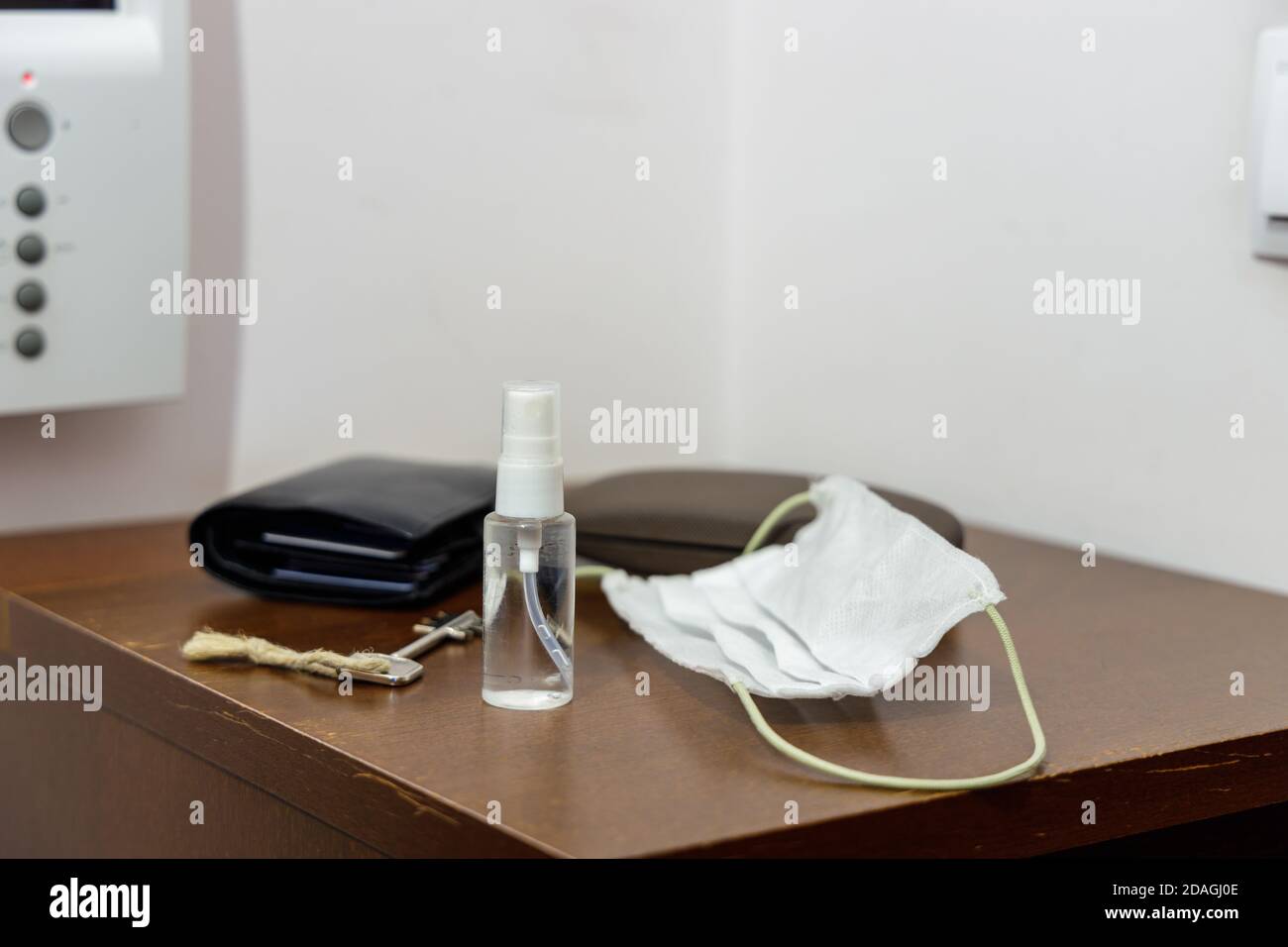 Pandemic setup ready before leaving home: face mask and disinfectant in ...