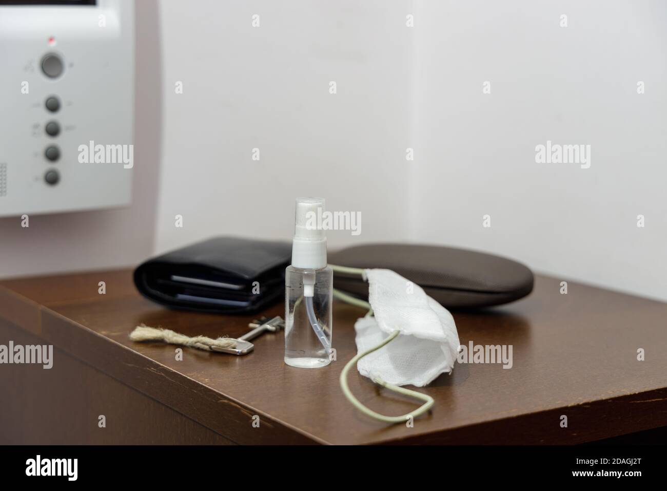 Pandemic setup ready before leaving home: face mask and disinfectant in ...