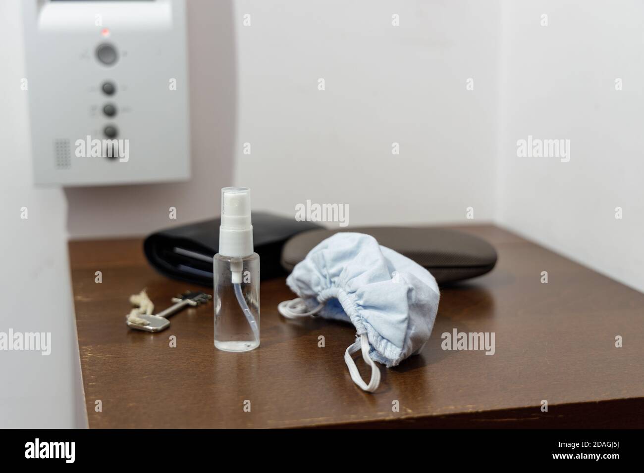 Pandemic setup ready before leaving home: face mask and disinfectant in ...