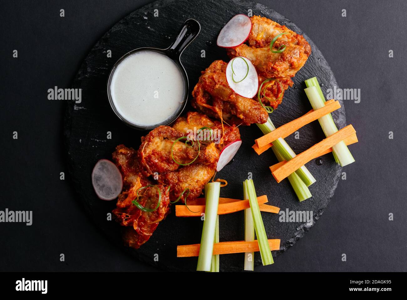 Asian-style chicken wings, fresh vegetables Stock Photo