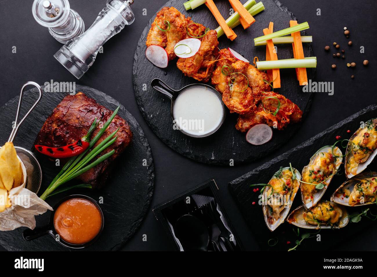 Asian-style chicken wings, fresh vegetables Stock Photo