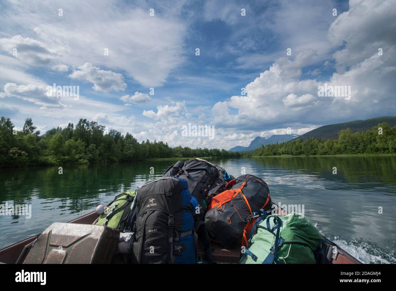 Small boat ferry carrying hikers from Kvikkjokk to trailhead of Padjelantaleden, Lapland, Sweden Stock Photo