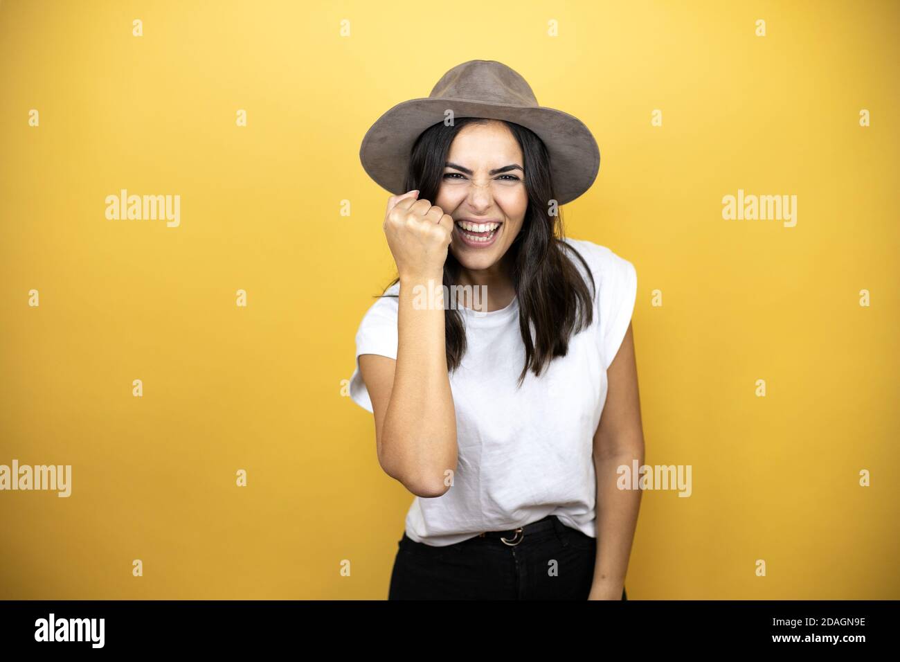 Angry young woman raising hand hi-res stock photography and images - Alamy