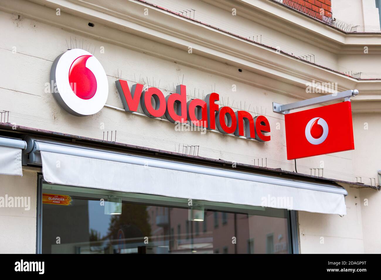 PASSAU / GERMANY - NOVEMBER 8, 2020: Branch logo of Vodafone. Vodafone GmbH is a German subsidiary of Vodafone Group plc, a company based in the UK. Stock Photo