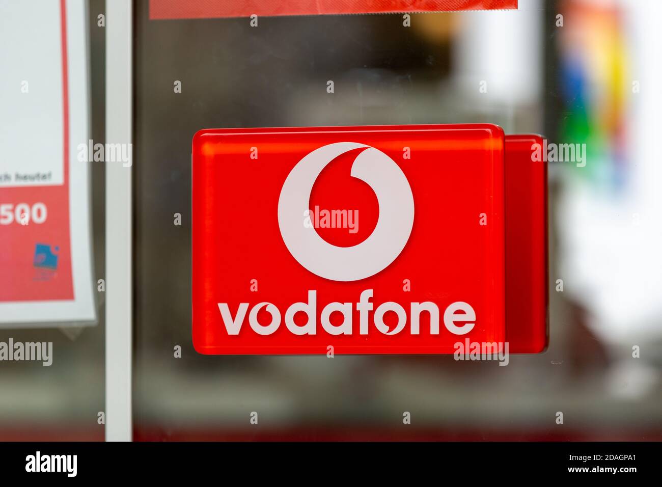 PASSAU / GERMANY - NOVEMBER 8, 2020: Branch logo of Vodafone. Vodafone GmbH is a German subsidiary of Vodafone Group plc, a company based in the UK. Stock Photo