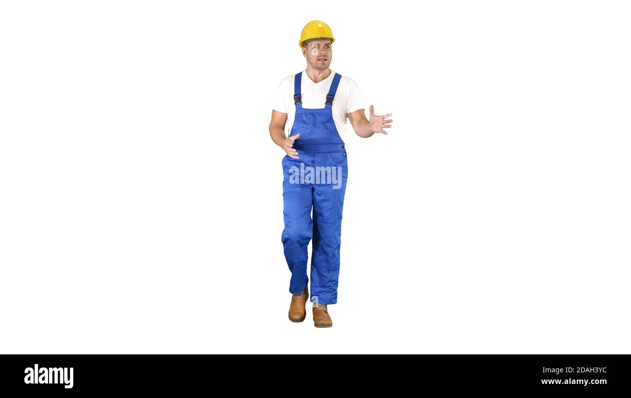 Foreman builder explaining something to camera and talking on white background. Stock Photo