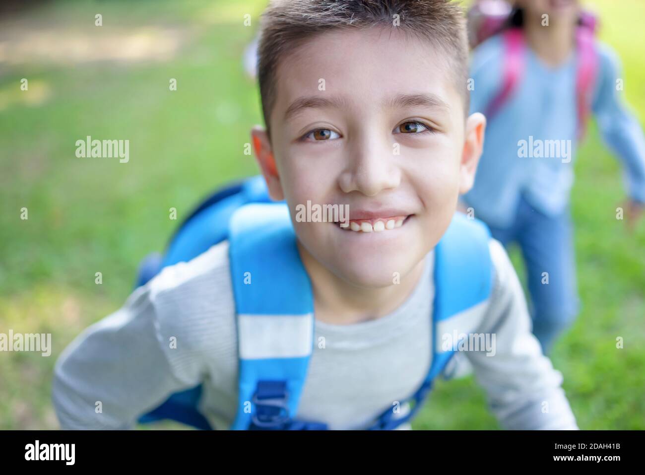 closeup naughty boy  running on the grass Stock Photo