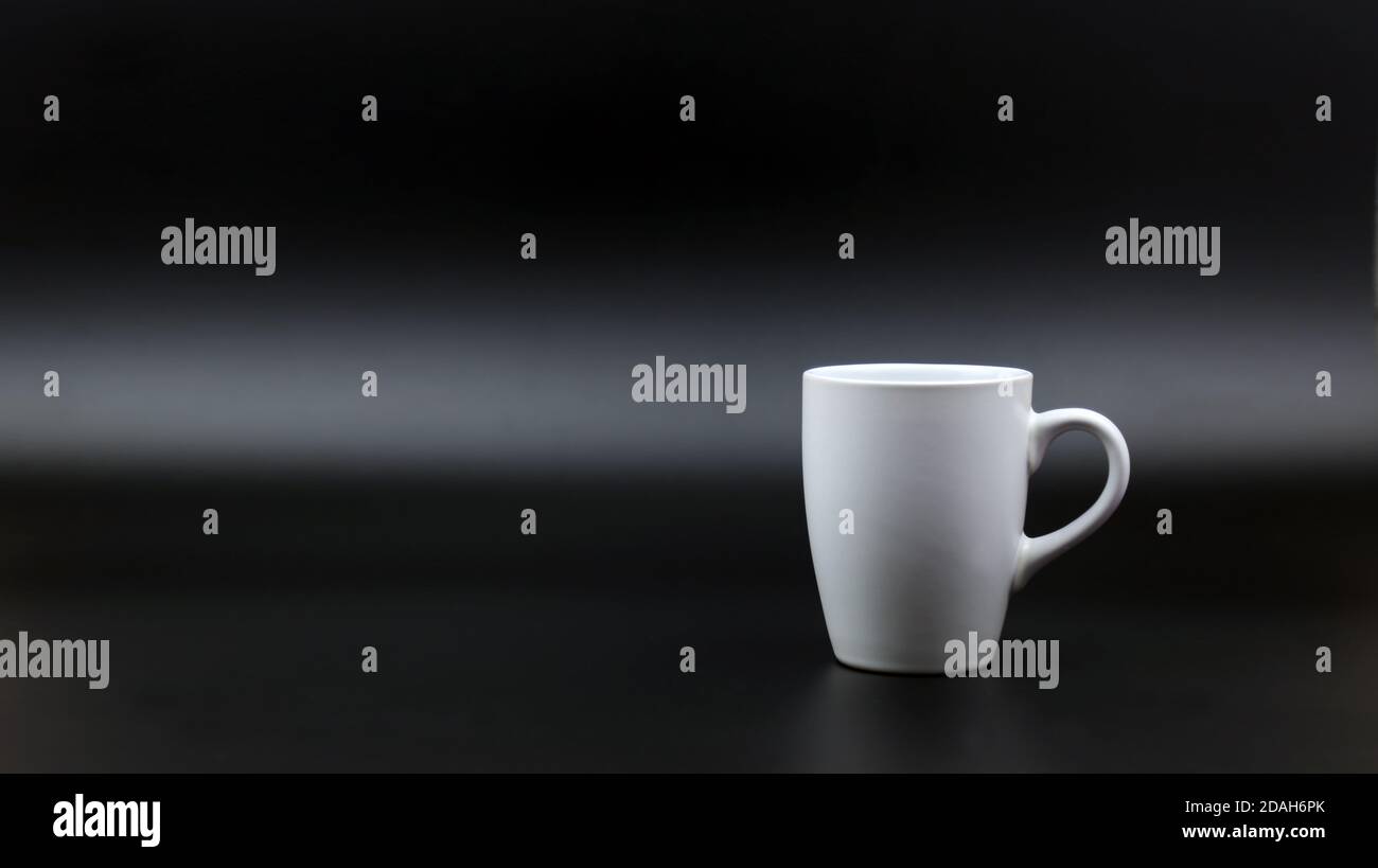 Close up black hot coffee white mug with black background. Refreshing concept Stock Photo