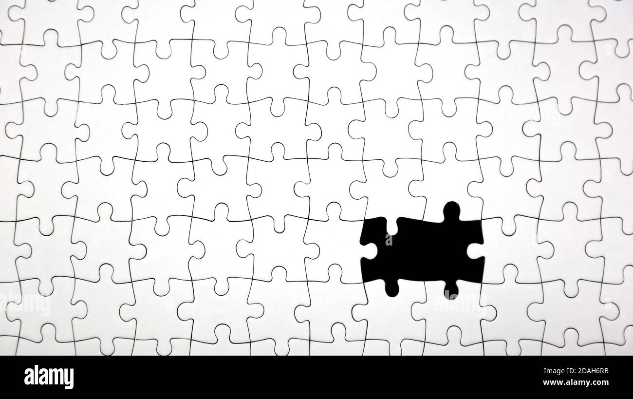 Missing parts fragment of white jigsaw puzzle. Image for problem, thinking, idea, success, puzzle, business and presentation concept. Stock Photo