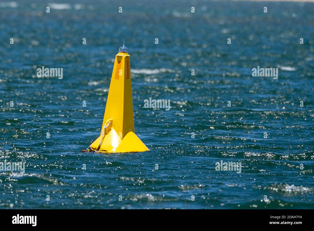 Yellow marine navigation caution buoy in the river Stock Photo - Alamy