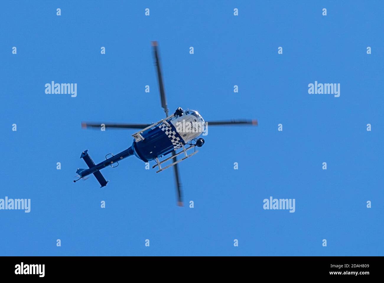 Upward shot of a queensland police helicopter Stock Photo