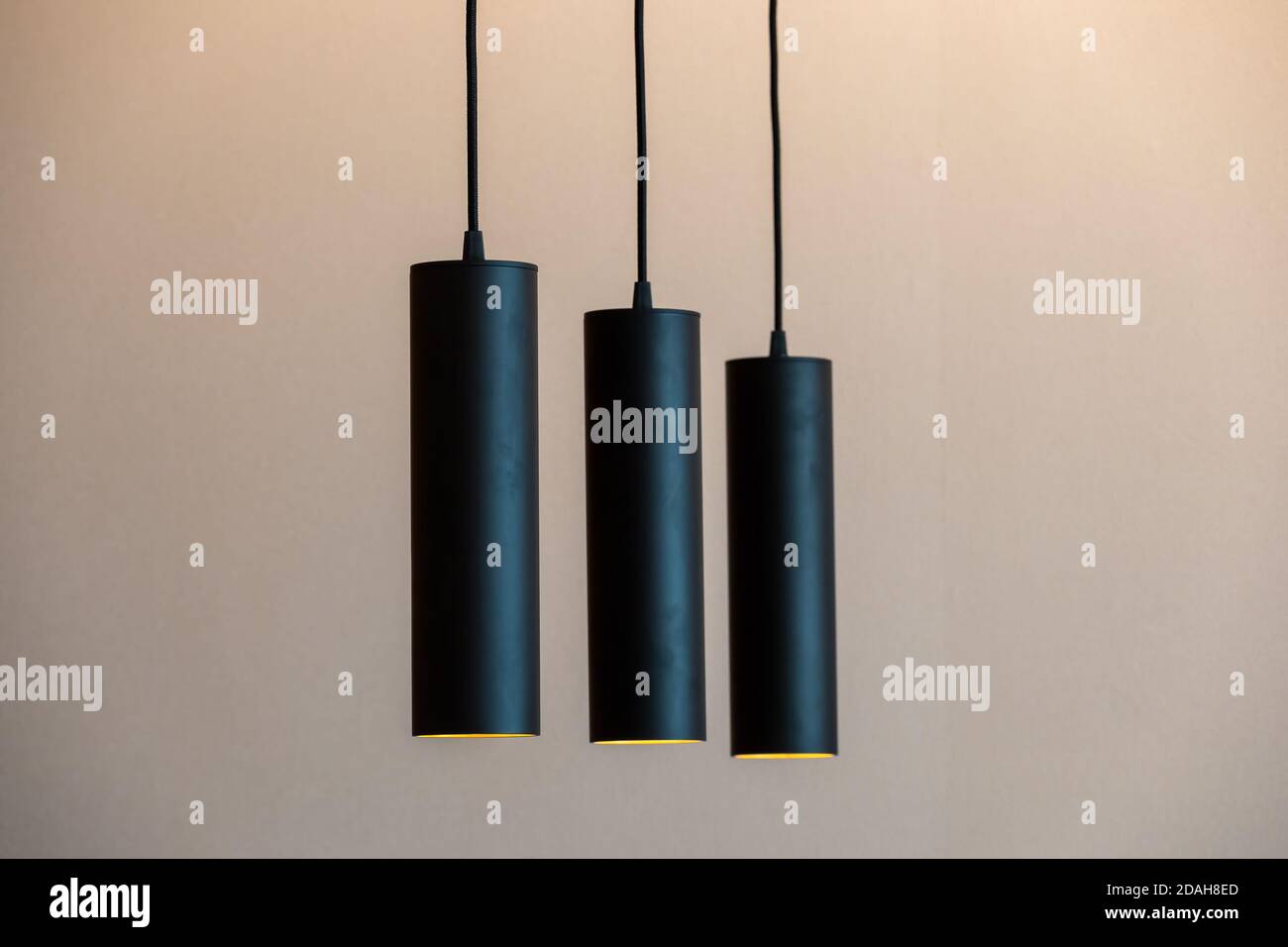 Vertical hanging lights in living room setting Stock Photo Alamy