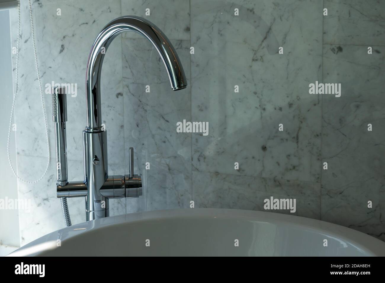 Modern bathroom column faucet in luxury bathroom. Stock Photo