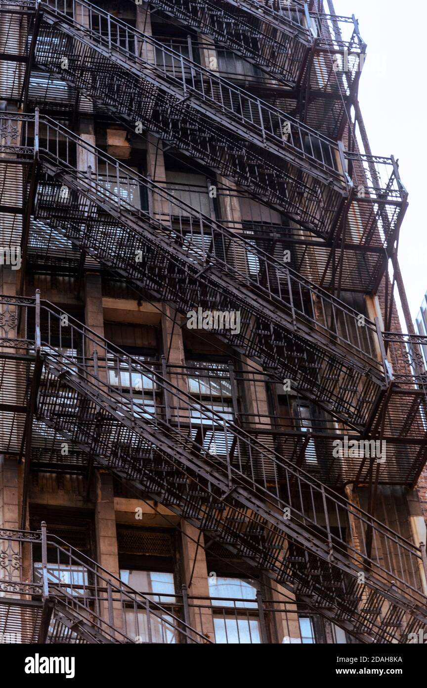 old apartment building in Chicago with outdoor fire escape ladder Stock