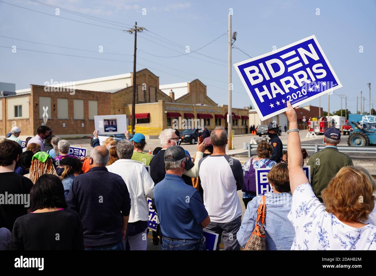 President trump and vice president mike pence supporters and joe biden and kamala harris supporters rallied together outside aluminum foundry. Stock Photo