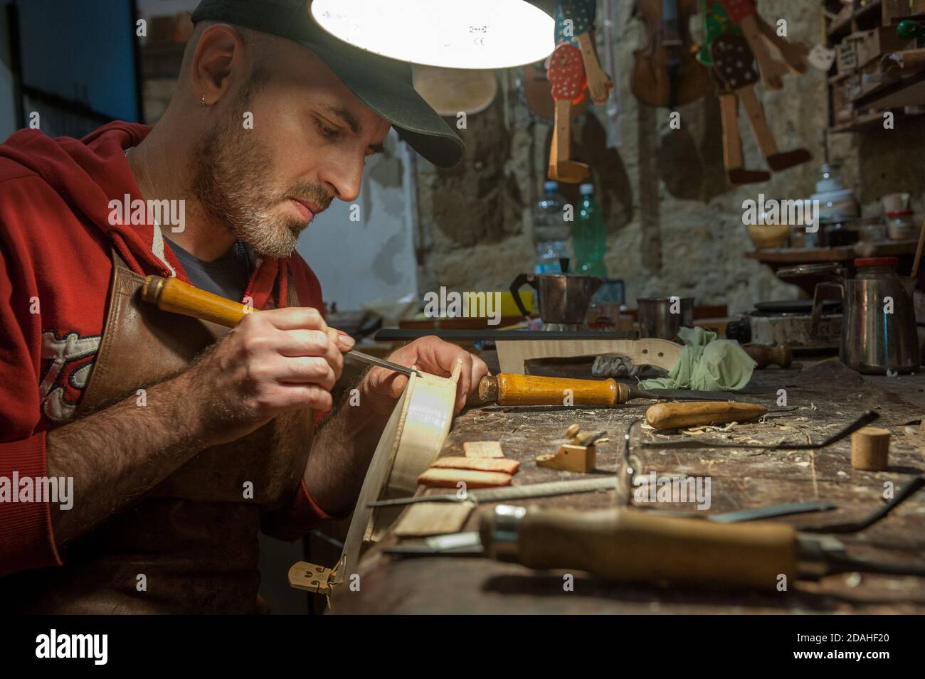 Neapolitan violin maker Alessandro Zanesco working in his  atelier Stock Photo