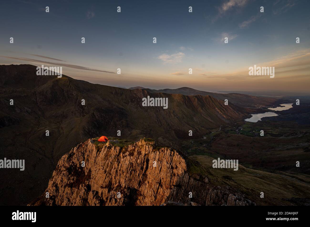 Tent on mountainside above valley in North Wales Stock Photo