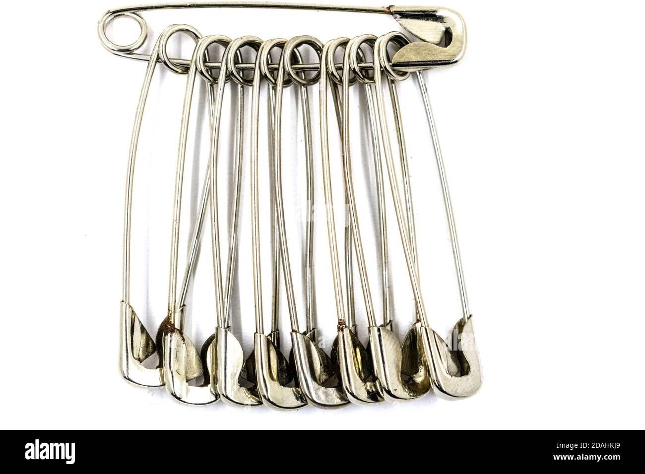Regular Sewing safety pins on white background Stock Photo Alamy