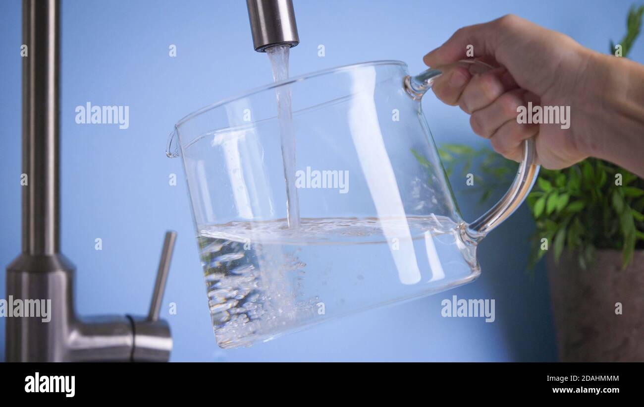 filling jug by tap water. Fresh and pure home water, drink water is