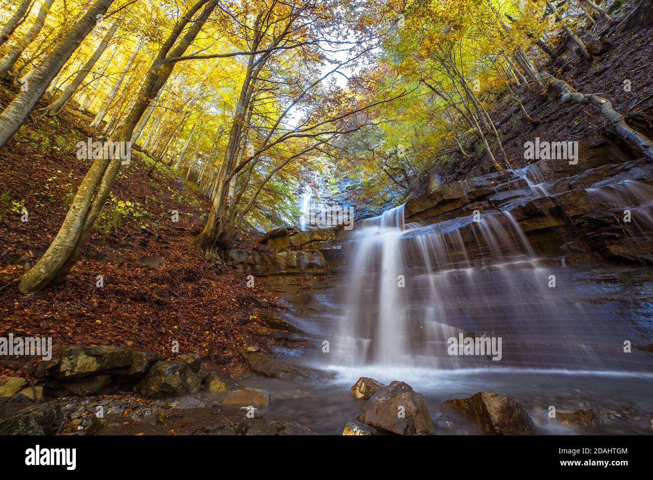 Scenic long exposure view of waterfall in the middle of the woods during  autumn, Cascate del Lavachiello, Monte cusna, Reggio Emilia, Italy Stock  Photo - Alamy