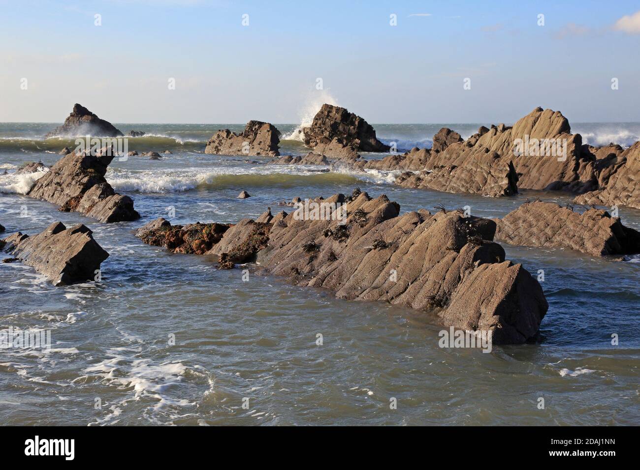 View of the rock ledges at Welcombe Mouth Beach on the Devon and Cornwall border Stock Photo