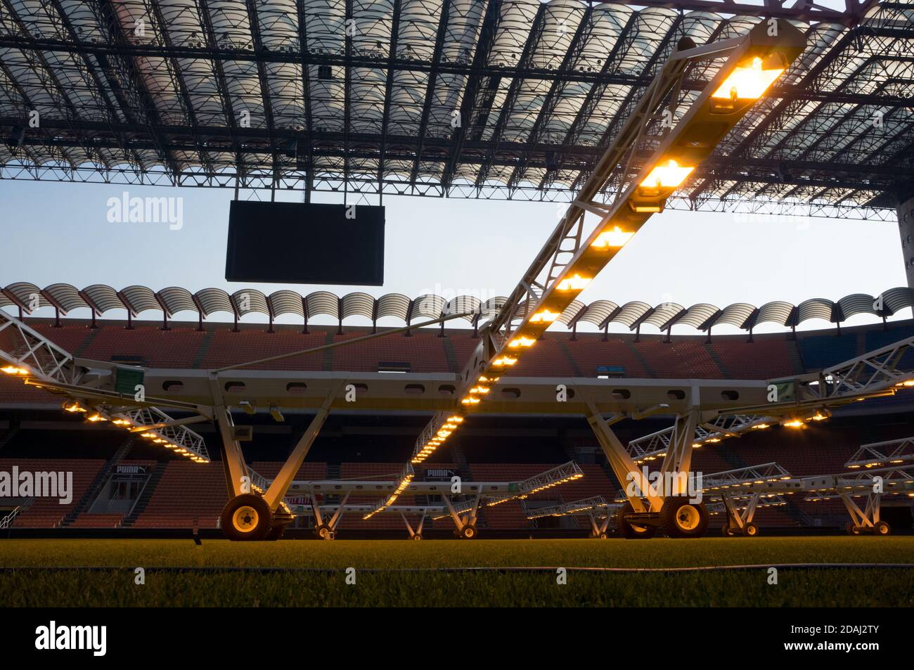 Artificial light  MLR for growing sports natural lawn illuminates the grass at the stadium Giuseppe Meazza or San Siro, built in 1925. Stock Photo