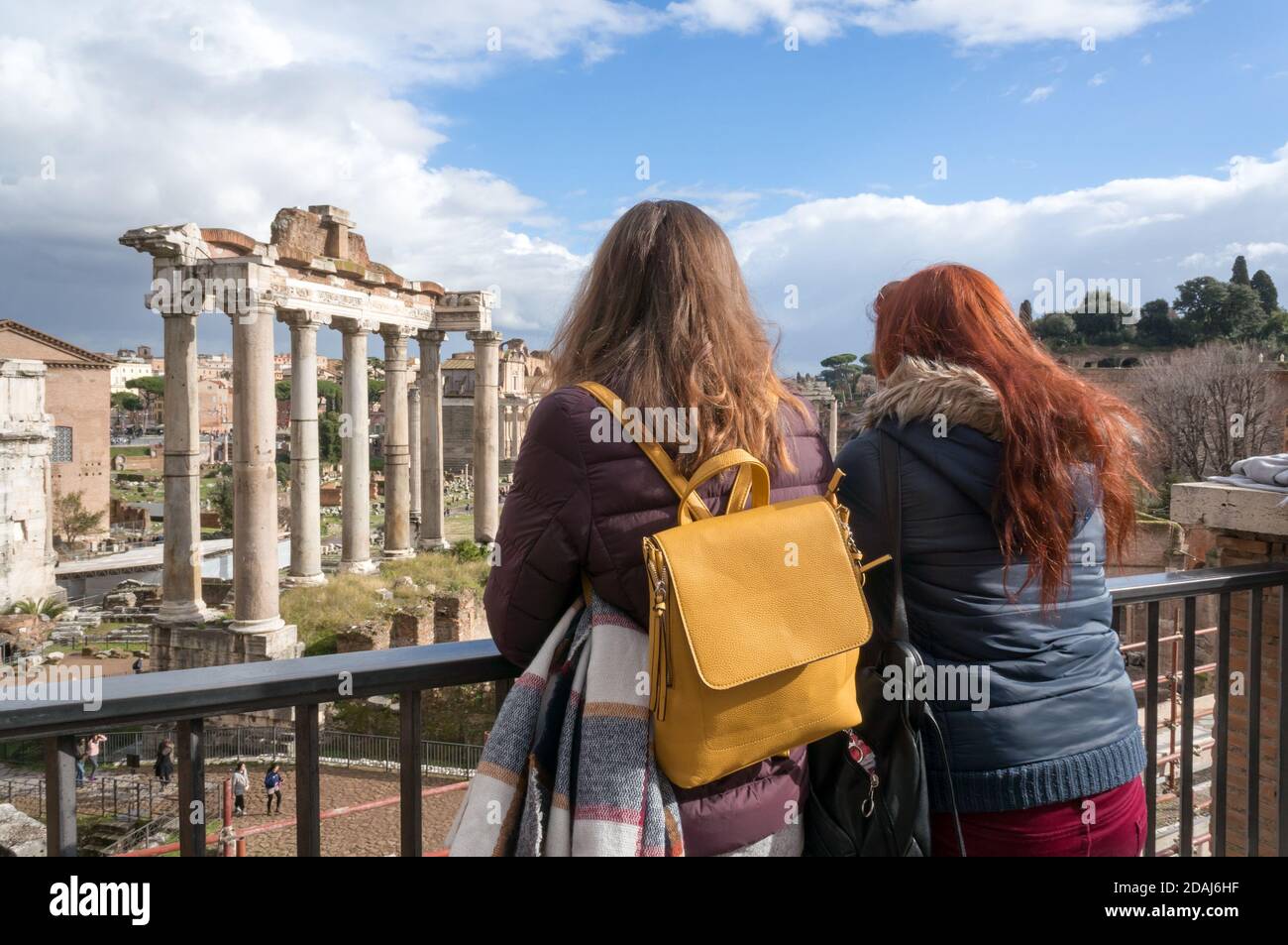 Two girls consider the ruins of Rome from the top of the old center. Stock Photo