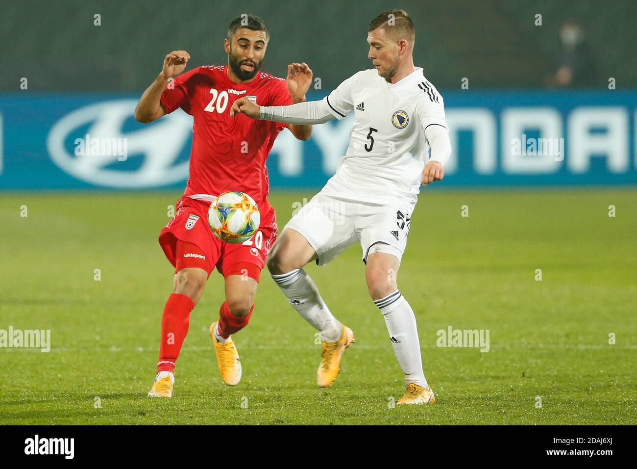 Iranian player Rezaei Kaveh, red dress challenge ball with Bosnian Bojan  Nastic during a friendly football match Bosnia vs. Iran Sarajevo, Bosnia  and Stock Photo - Alamy