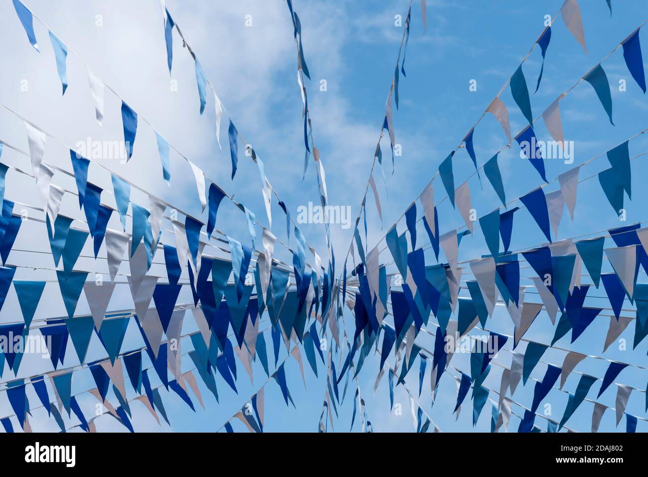 Blue and white bunting in St Ives, Cornwall, UK Stock Photo