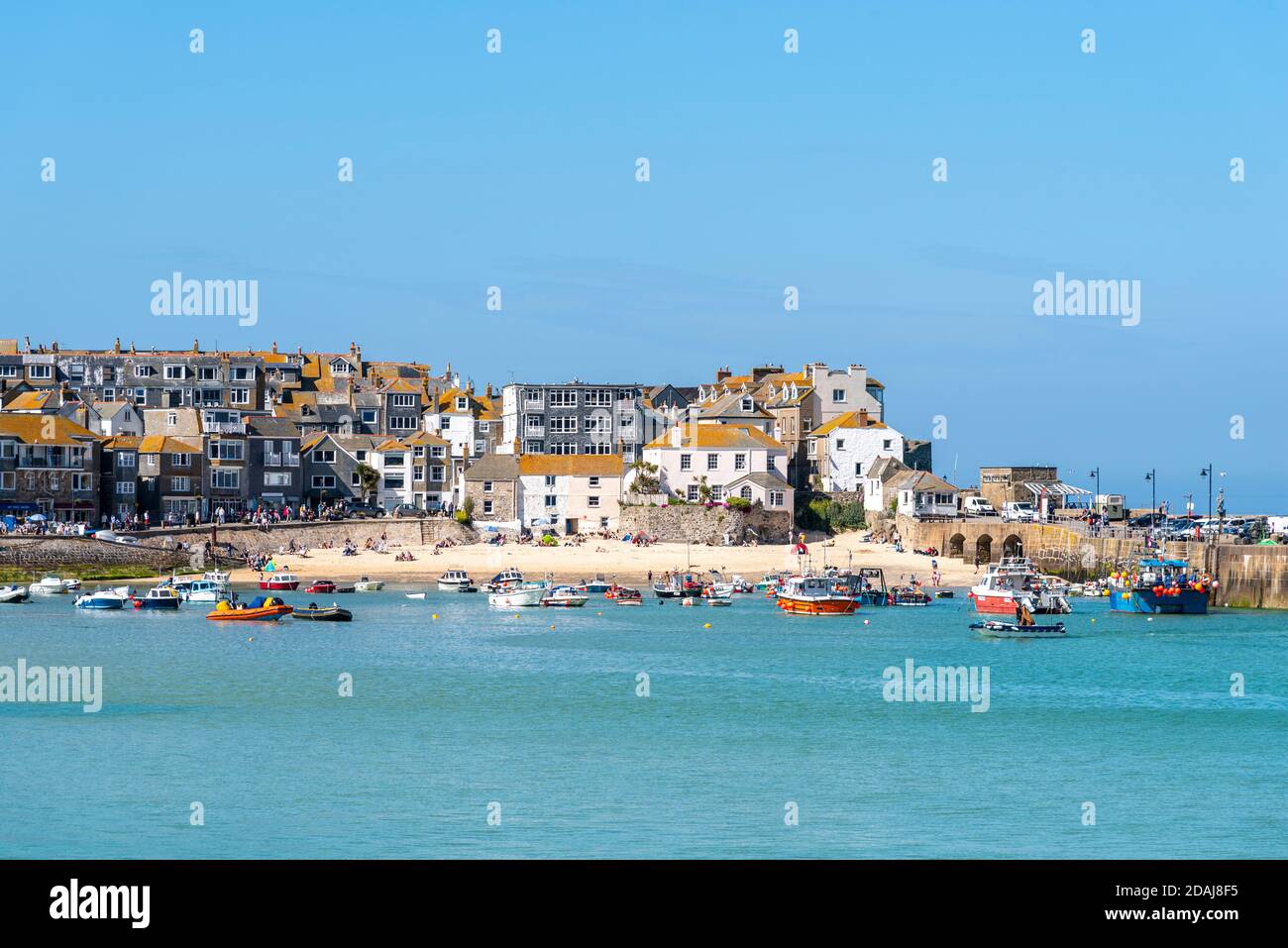 Boats on water in St Ives harbour at high tide. Cornwall, UK Stock Photo