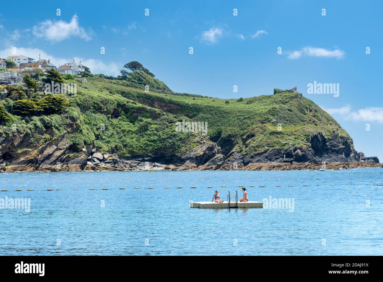 People in the sea at Readymoney Cove, Fowey, Cornwall Stock Photo
