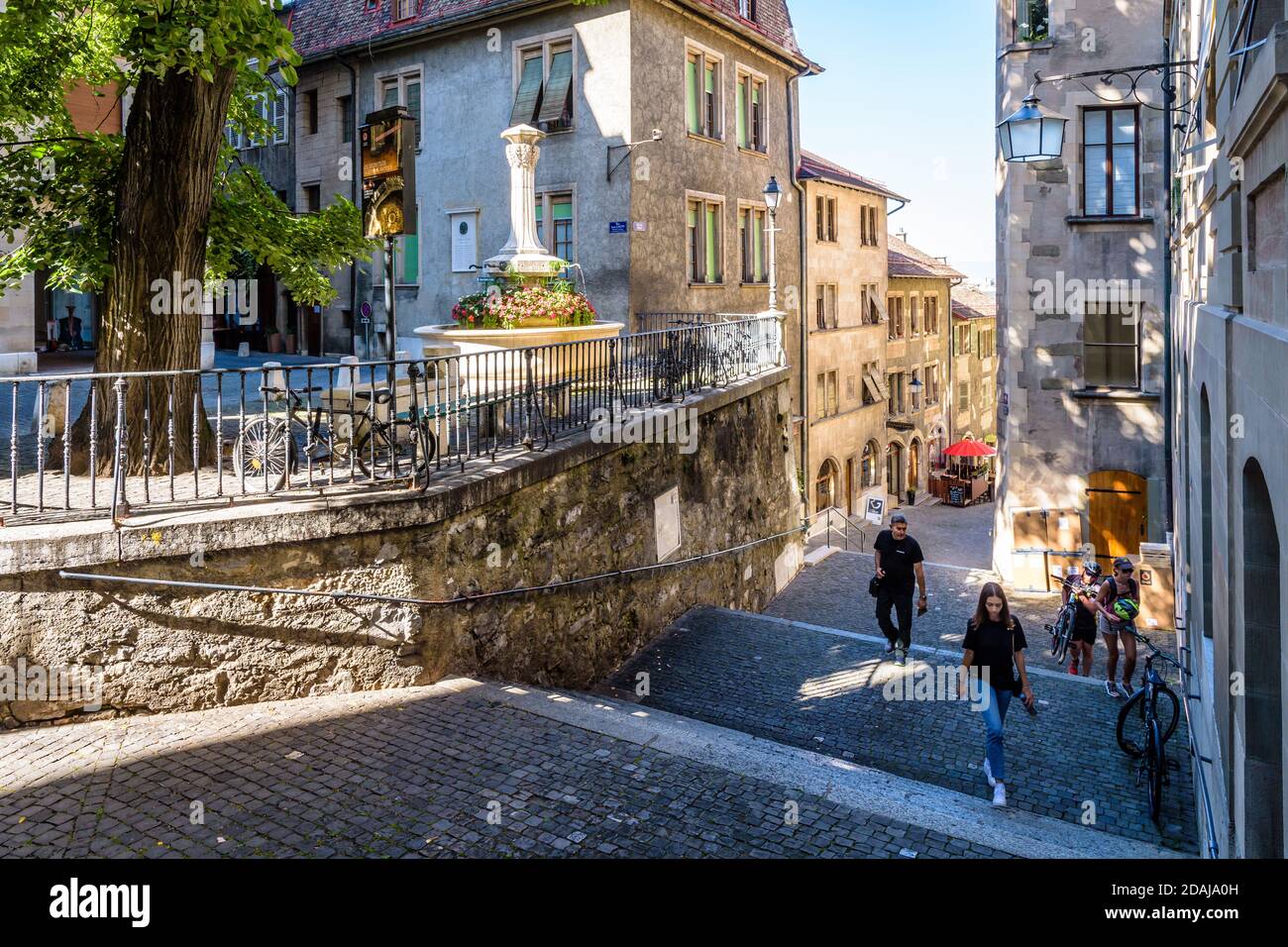 People Are Going Up The Rue Du Perron A Narrow Steep Street That Leads To The Upper Part Of Geneva S Old Town Situated On A Hill Stock Photo Alamy