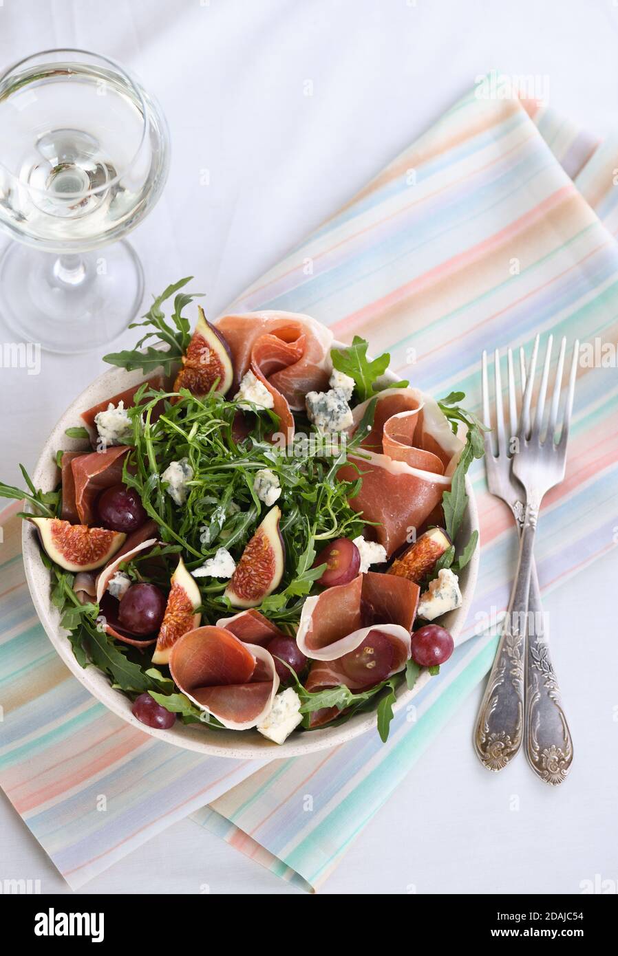 Arugula salad with Parma ham, blue cheese, figs, grapes Stock Photo Alamy