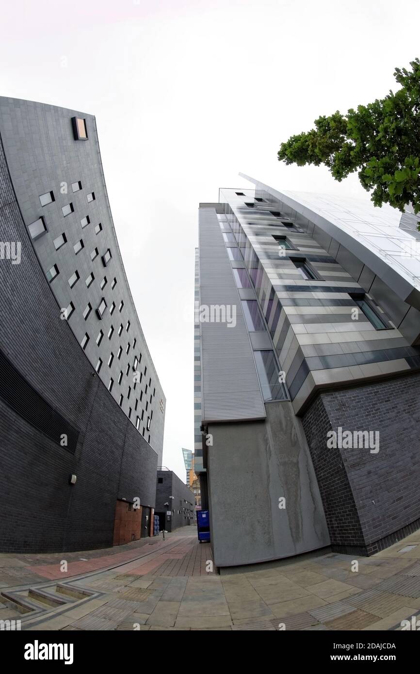 Alleyway between the modern Crowne Plaza and Holiday Inn Express Manchester City Centre Arena hotels. Stock Photo