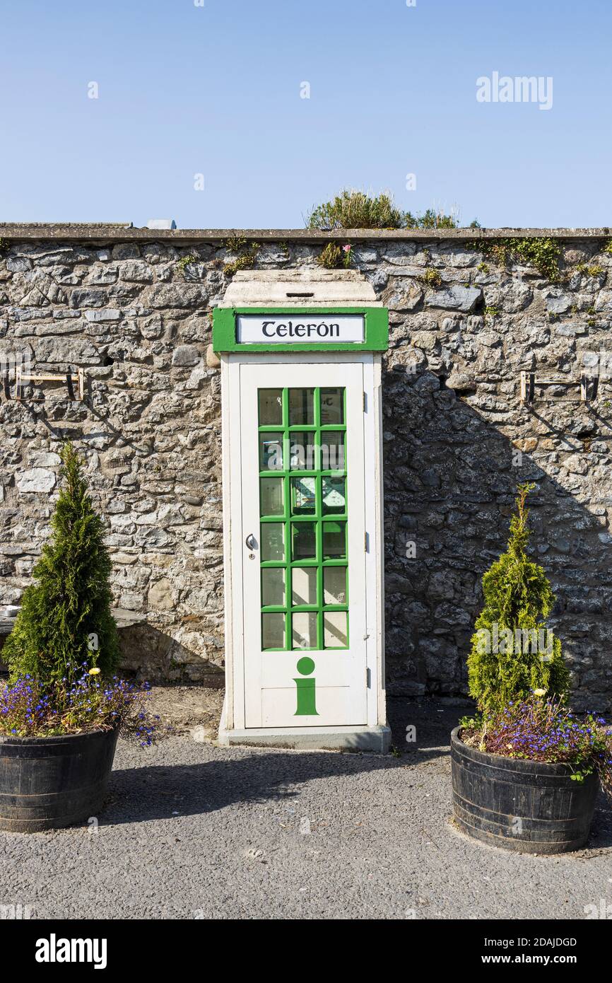 Old disused public telephone kiosk, cabin in Kells village, now houses tourist information, County Kilkenny, Ireland Stock Photo
