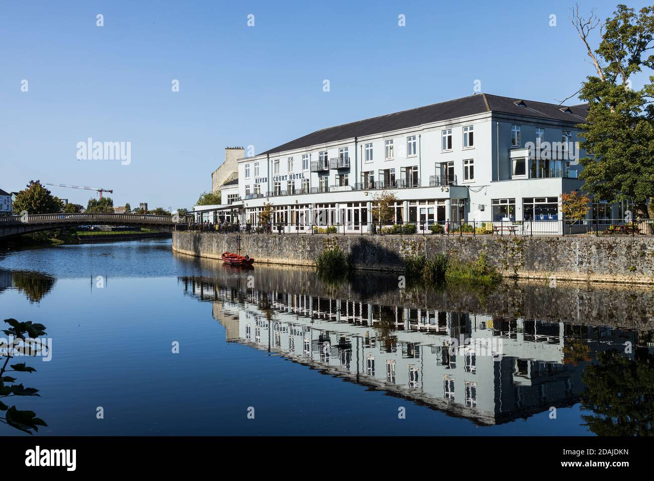 River Court Hotel reflected in the river Nore in Kilkenny, County Kilkenny, Ireland Stock Photo