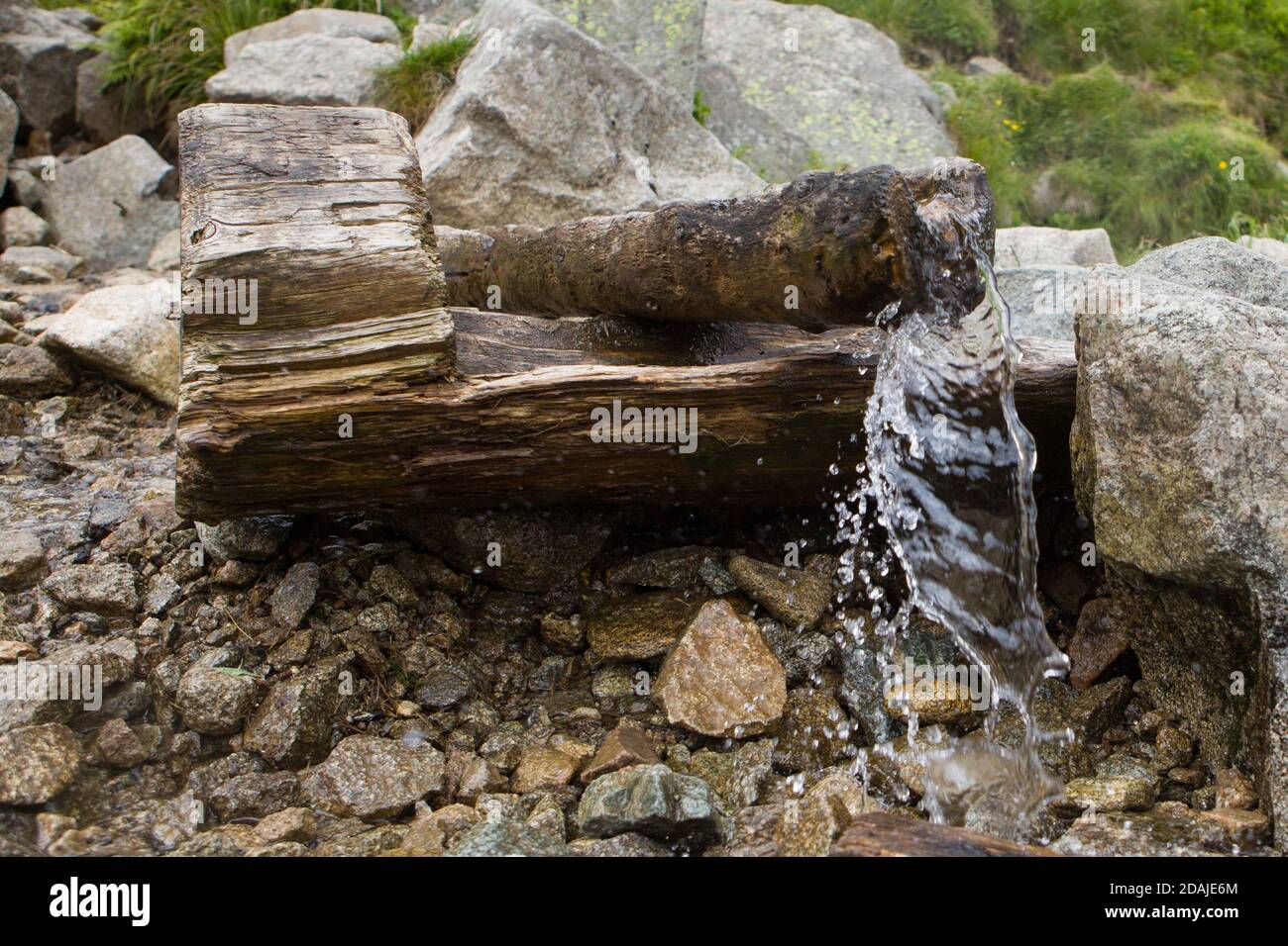Source of spring fresh water. Near mount. Water spring in the mountains. Stock Photo