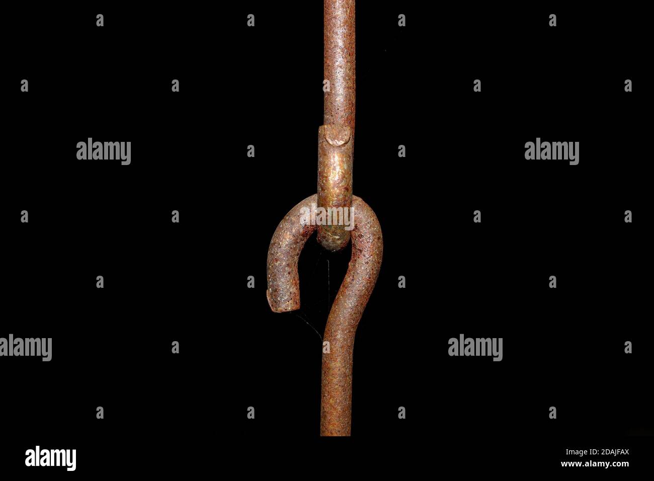 Rusted metallic chains holding together. Swing metal chain Links closeup. Black background. Stock Photo