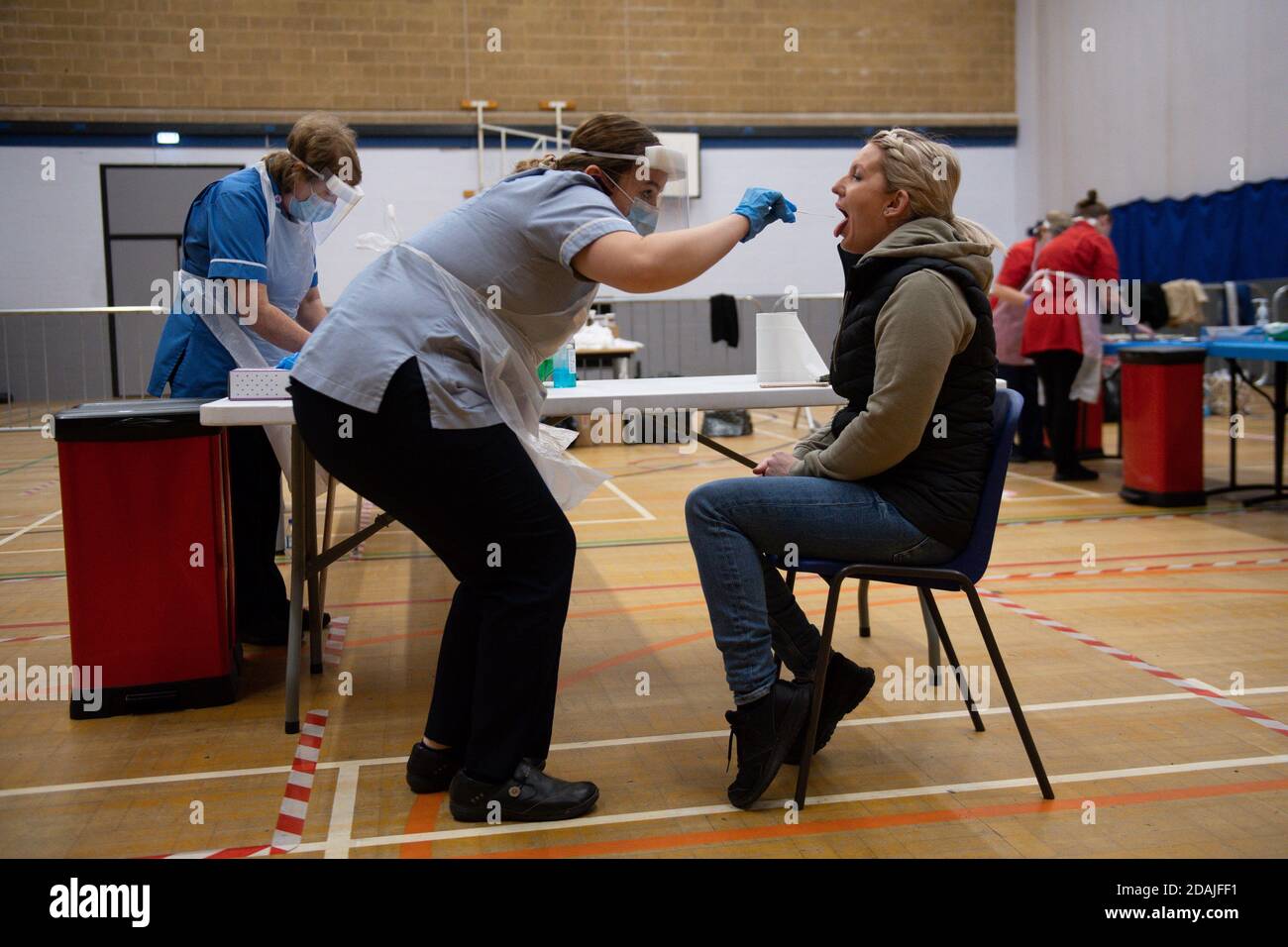 A nurse administers a test on Sarah Key at Dimensions Leisure Centre in Stoke-on-Trent during a testing session held by Stoke-on-Trent City Council using the newly-supplied lateral flow Covid-19 tests. Stock Photo