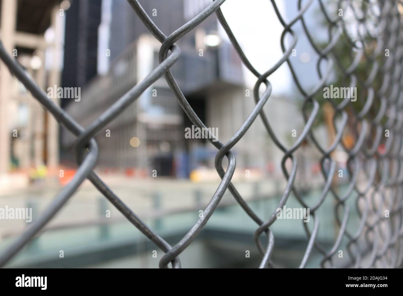 Metal Wire Mesh Fence in the City Stock Photo