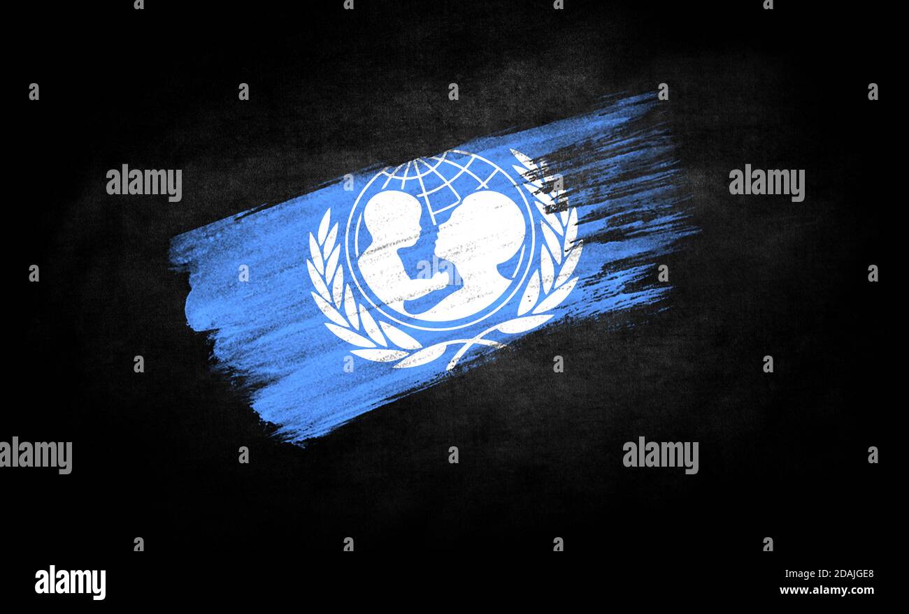 smear of paint in the form of the flag of United Nations Children's Fund close-up on a black background Stock Photo