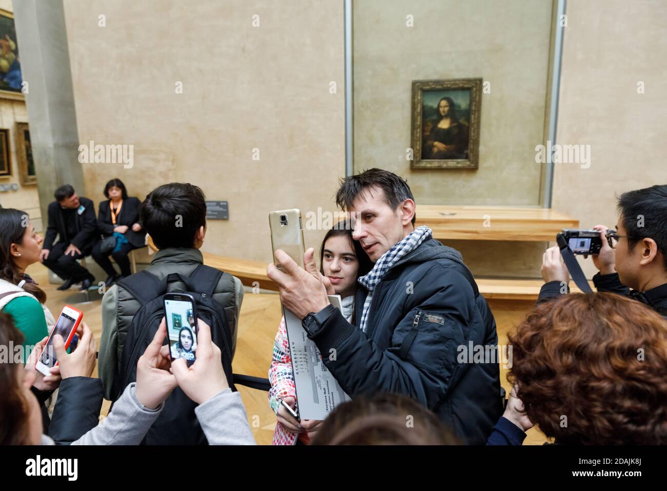 PARIS, FRANCE - Nov 10, 2017: Visitors do selfie and take photo of Leonardo Da Vinci's Mona Lisa at the Louvre Museumn. Mona Lisa or La Gioconda is on Stock Photo