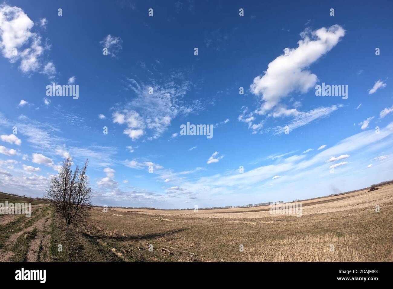 Blue sky with white clouds over farmland. Landscape Stock Photo - Alamy