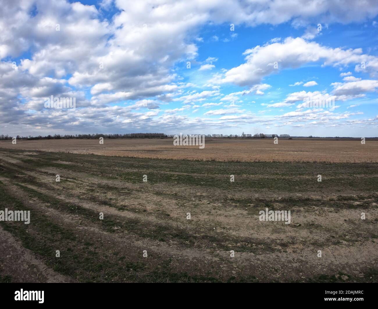 Blue sky with white clouds over farmland. Landscape Stock Photo - Alamy