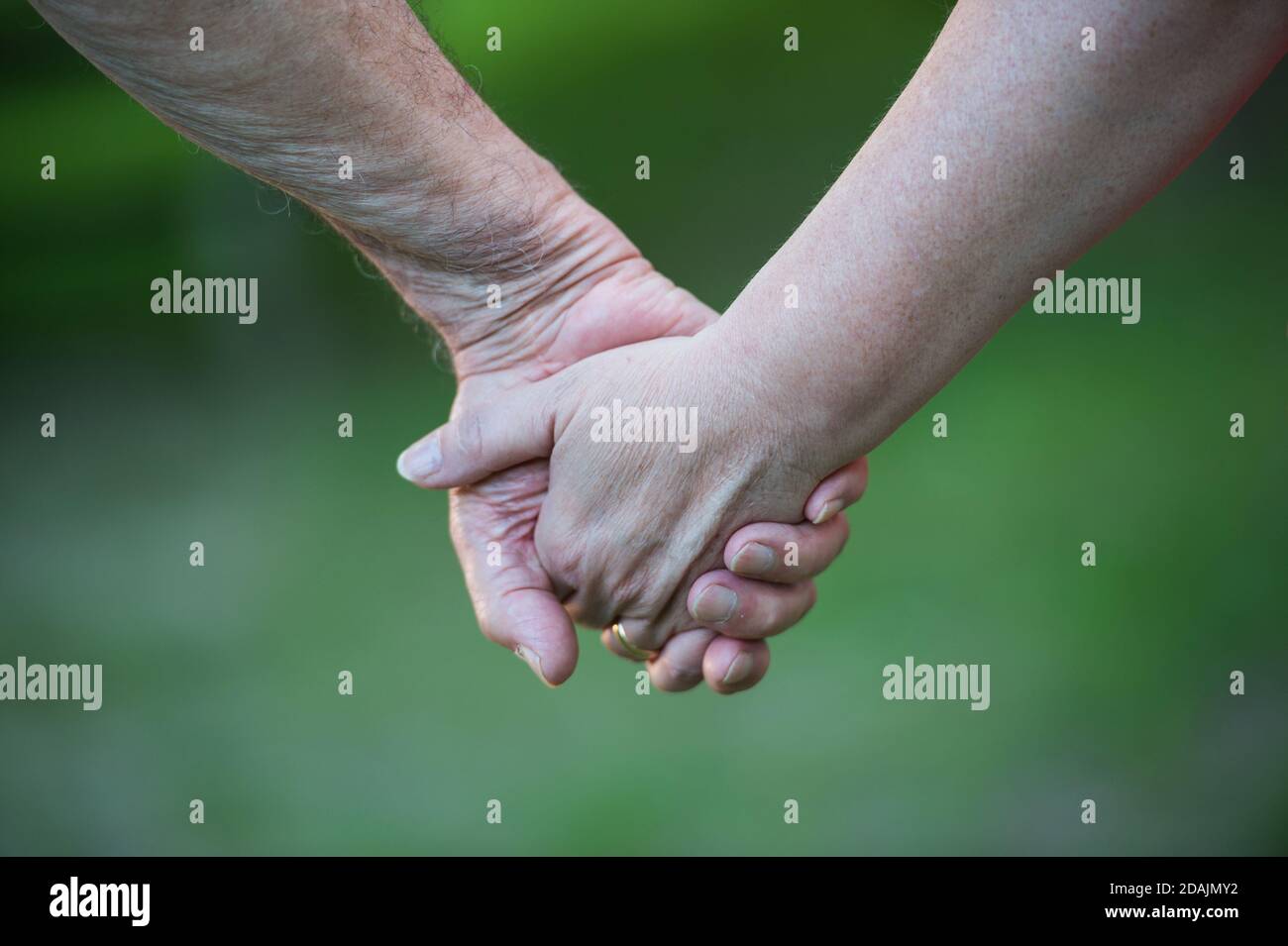 Young man woman holding hands hi-res stock photography and images - Alamy