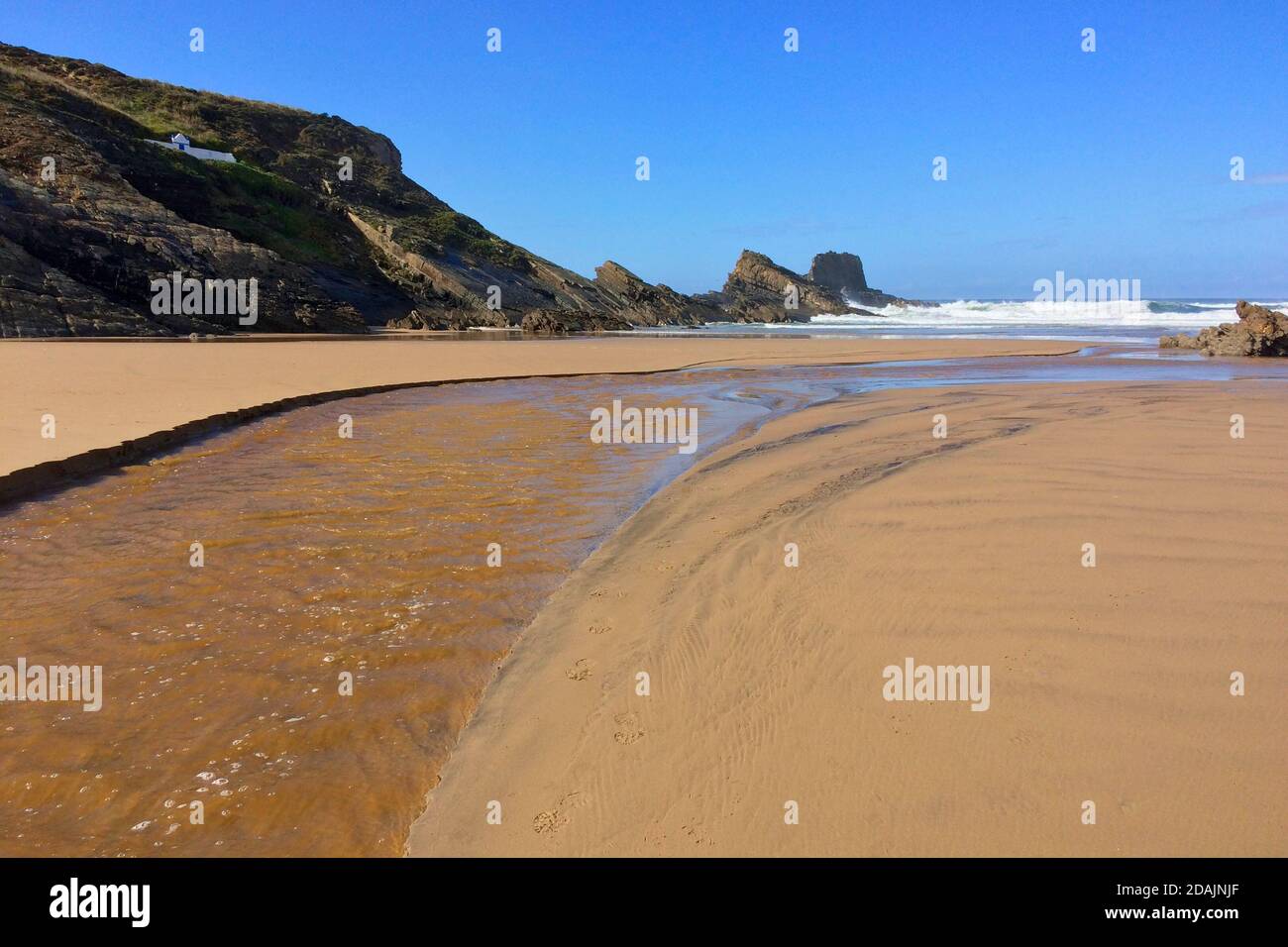 river flows into the ocean, stream flows to the sea, sandy river ...