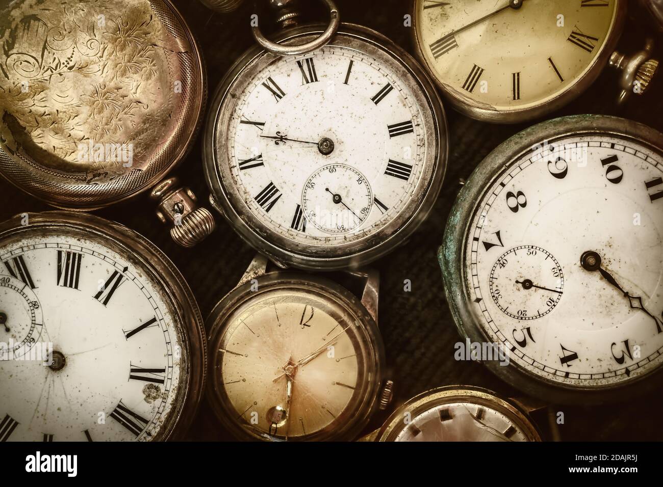 Retro styled image of old scratched and run down pocket watches Stock Photo